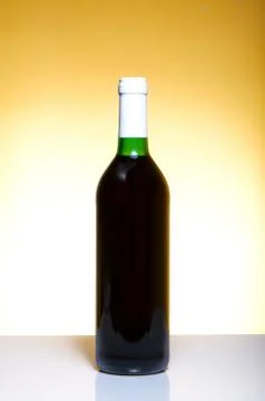 Vine bottle on orange background Stockfoto's