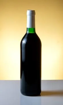 Vine bottle on orange background Stock Photos