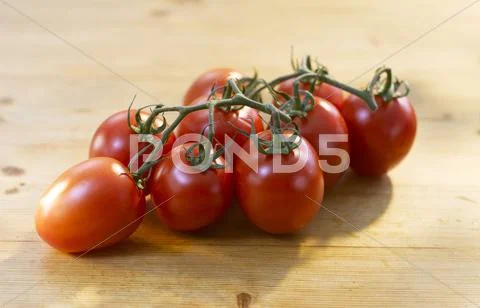 Vine Ripe Tomatoes on Wood Stock Photos