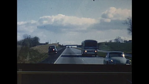 Vintage 16mm film, 1958 motorhome drive plate highway rear view Stock Footage