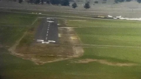 Vintage 1950s View of runway from small plane. 8mm home video. Stock Footage 279860746