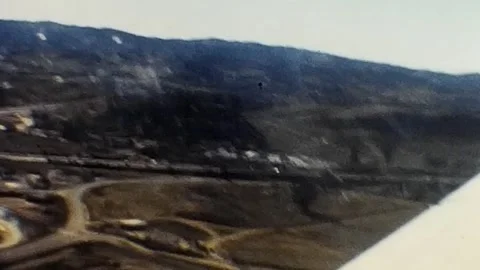 Vintage 1950s View from small plane over wing. 8mm home video. Stock Footage 279860710