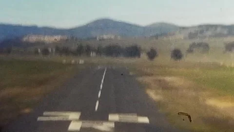 Vintage 1950s View from small plane of landing on runway. 8mm home video. Stock Footage 279860851