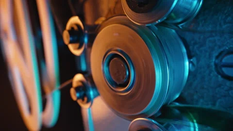 Vintage 8mm film projector, rotating reels. Nostalgic charm of classic cinema. Видео 263556634