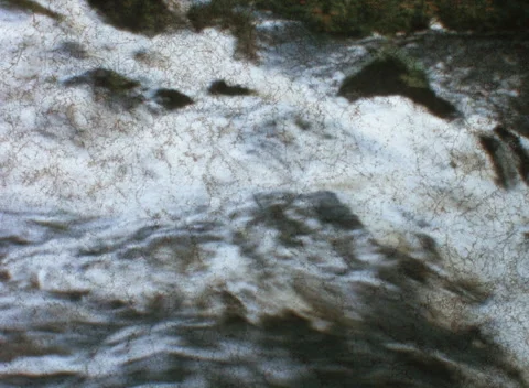 Vintage 8mm River Rapids Damaged Mold and Light Leak Archival 3K Scan Stock Footage 337955927