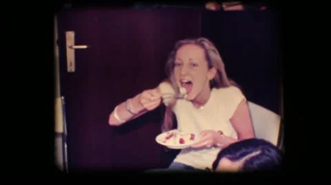 Vintage 8mm. Young woman eating cake Stock Footage