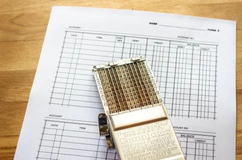 Vintage adding machine on ledger accounting page Stock Photos
