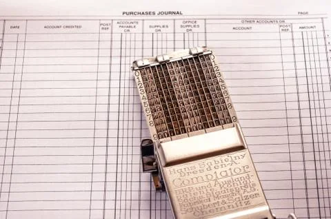 Vintage adding machine on ledger purchases journal page Stock Photos