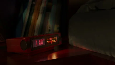 Vintage alarm clock with digital dial and radio waking up at 7 AM. Close-up view Stock Footage