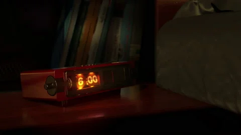 Vintage alarm clock with flip dial and radio wake up at 6 AM Stock Footage 147129043