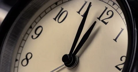 Vintage alarm clock is showing midday or midnight movement. It is twelve o'cl Stock Footage