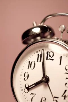 Vintage alarm clock on a solid color background Stock Photos