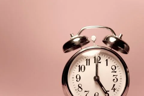 Vintage alarm clock on a solid color background Stock Photos