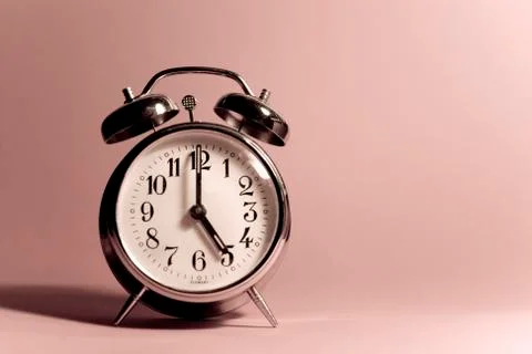 Vintage alarm clock on a solid color background Stock-Fotos