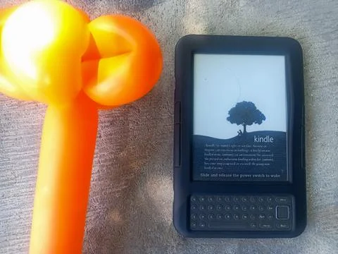 Vintage Amazon Kindle third generation e-reader with physical QWERTY keyboard Stock Photos