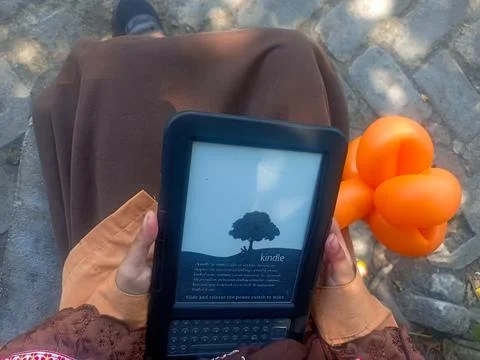Vintage Amazon Kindle third generation e-reader with physical QWERTY keyboard Stock Photos