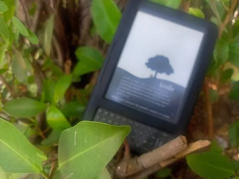 Vintage Amazon Kindle third generation e-reader with physical QWERTY keyboard Stock Photos