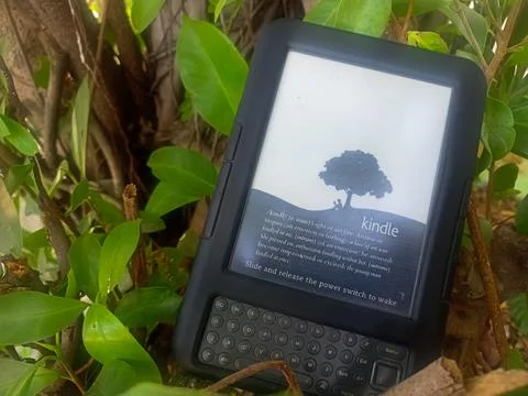 Vintage Amazon Kindle third generation e-reader with physical QWERTY keyboard Stock Photos