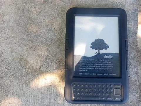 Vintage Amazon Kindle third generation e-reader with physical QWERTY keyboard Stock Photos