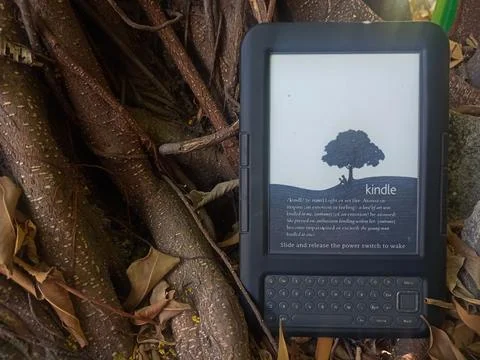 Vintage Amazon Kindle third generation e-reader with physical QWERTY keyboard Stock Photos