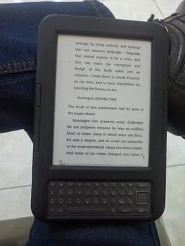 Vintage Amazon Kindle third generation e-reader with physical QWERTY keyboard Stock Photos