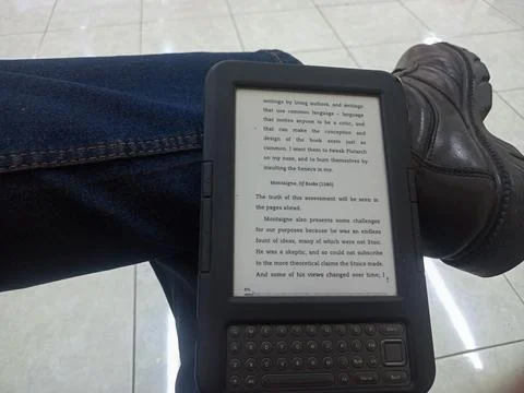 Vintage Amazon Kindle third generation e-reader with physical QWERTY keyboard Stock Photos
