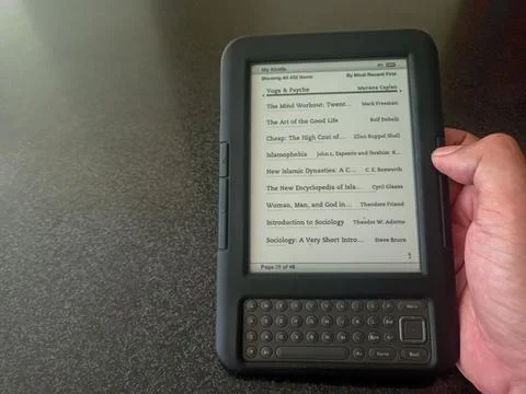 Vintage Amazon Kindle third generation e-reader with physical QWERTY keyboard Stock Photos
