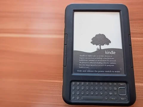 Vintage Amazon Kindle third generation e-reader with physical QWERTY keyboard Stock Photos