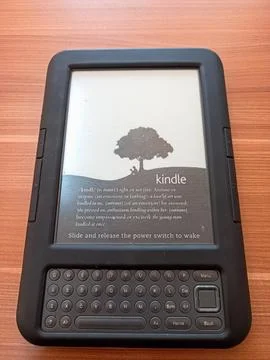 Vintage Amazon Kindle third generation e-reader with physical QWERTY keyboard Stock Photos