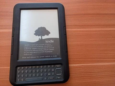 Vintage Amazon Kindle third generation e-reader with physical QWERTY keyboard Stock Photos