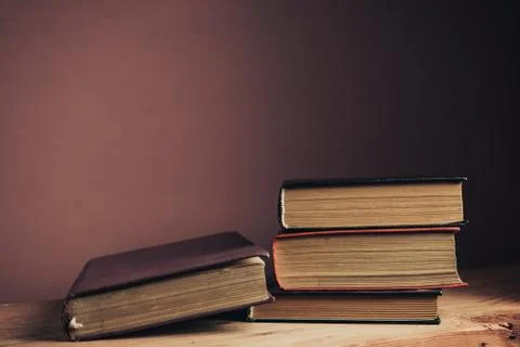 Vintage ancient books. Pattern background for design. The book on a brown woo Stock Photos