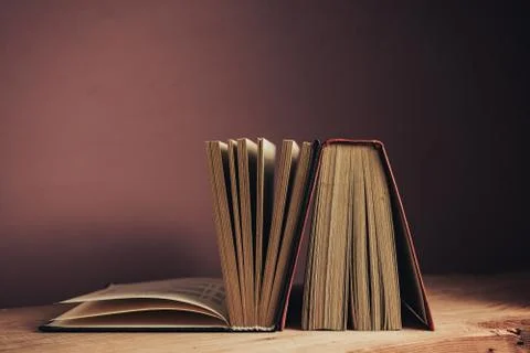 Vintage ancient books. Pattern background for design. The book on a brown woo Stock Photos