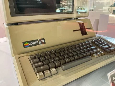 Vintage Apple computer on display in a museum or showroom, angled to face the Stock Photos