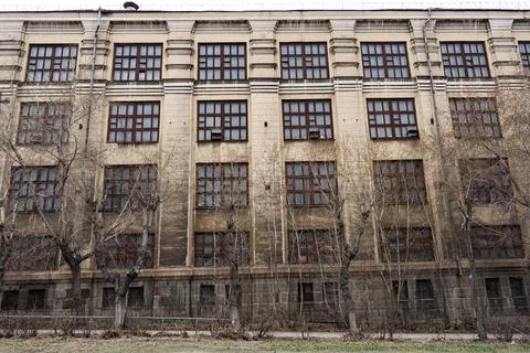 Vintage architecture classical facade old gray building front view. A house o Stock Photos