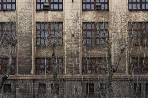 Vintage architecture classical facade old gray building front view. A house o Stock Photos