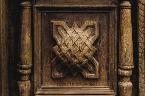 Vintage background. Elements of an old carved wooden door decorated with Fotos de archivo