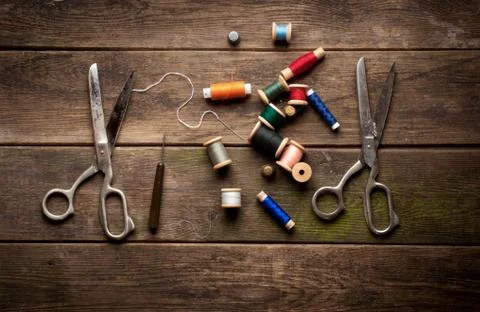 Vintage Background with sewing tools and colored tape. Sewing kit. Scissors, Stock Photos