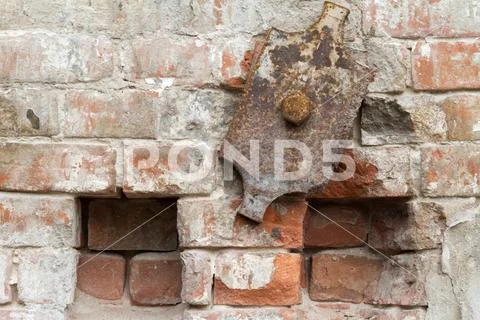 Vintage background texture of old brick masonry on ancient cement with crac.. Stock Photos