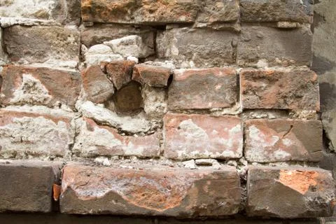 Vintage background texture of old brick masonry on ancient cement. Stock Photos