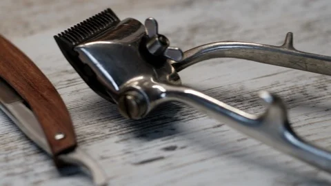 Vintage barber tools dangerous razor hairdressing scissors old manual clipper Stock Footage 121806356
