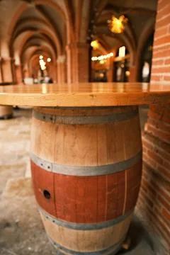 Vintage Barrel Table in Rustic Corridor Stock Photos