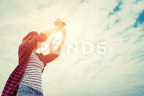 Vintage of beautiful women photography standing hand holding retro camera wit Stock Photos