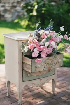 A vintage beige bedside table Stock Photos