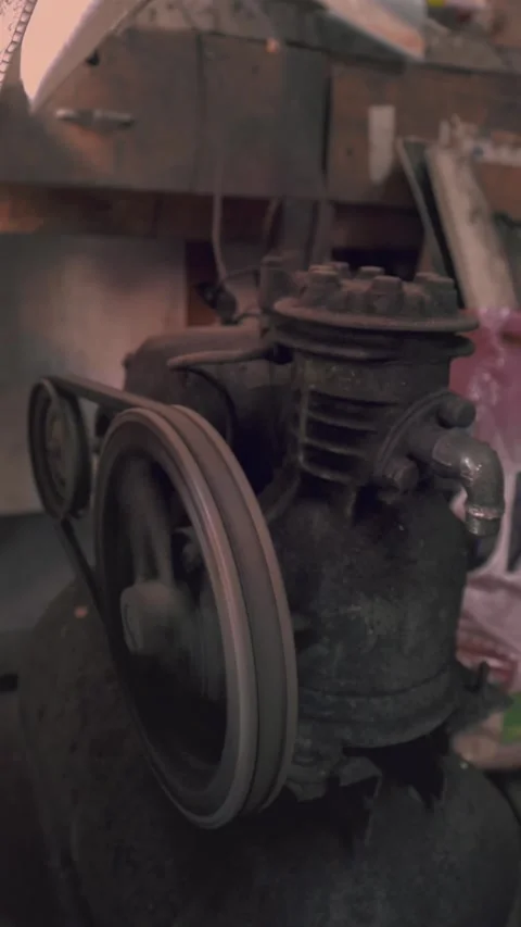 "Vintage Belt-Driven Engine Running – Old Car Paint Shop Machine in Action" Stock Footage 299576220