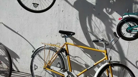 Vintage Bicycles on the wall. Stock Footage 75824890