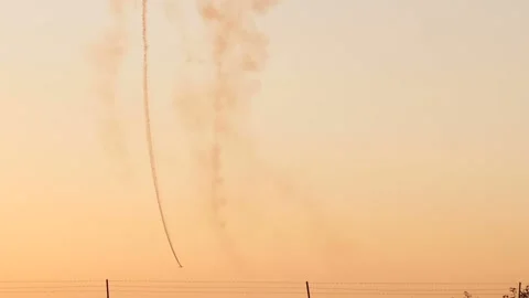 Vintage biplane does loop stunt with smoke trails. Stock Footage 165972392