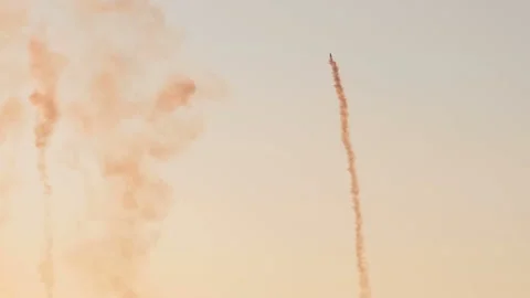 Vintage biplane does loop stunt with smoke trails. Stock Footage 165972417