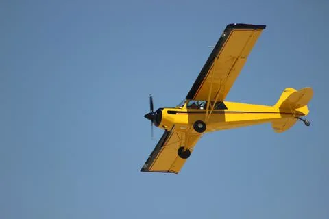 Vintage biplane does loop stunt with smoke trails. airplane air Stock Photos
