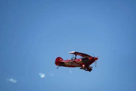 Vintage biplane does loop stunt with smoke trails. airplane air Stock Photos