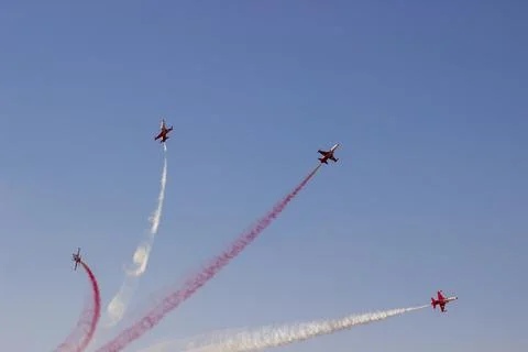 Vintage biplane does loop stunt with smoke trails. airplane air show Stock Photos